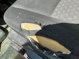 a dirty seat in the back of a car