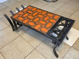 a coffee table that has been painted orange and black