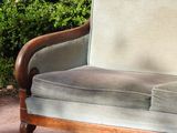 a couch that is sitting in the middle of the street