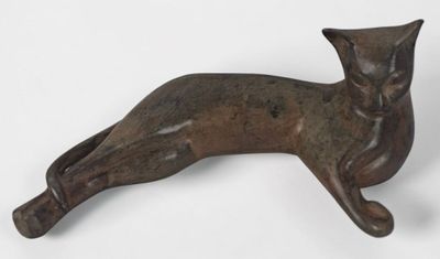 bronze cat figurine on a white background