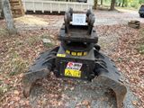 a machine that is sitting on the ground in the woods