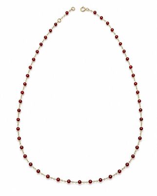 a red beaded necklace on a white background