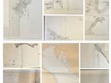 many maps of the world displayed on the wall
