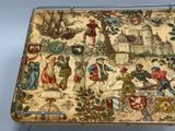 a tray that has a picture of people and animals on it