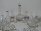 a lot of glass vases and bowls on the table