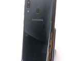 a picture of a cell phone that is sitting on a stand