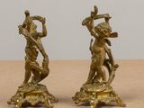 pair of antique brass figurines of a boy and a girl