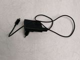 a black charger plugged into a black charger on a white surface