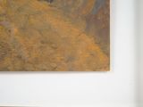 a picture of a painting hanging on the wall above a bed