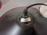 a black lamp that is on top of a table
