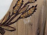 an image of a dress with a bunch of flowers embroidered on it