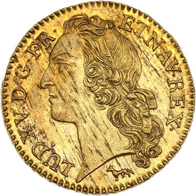 gros plan d'une pièce d'or portant un visage de femme