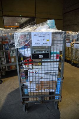 a cart with a lot of items on it in a warehouse