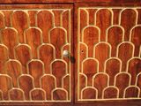 a wooden cabinet with a door and a drawer on top of it