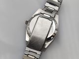 an image of a wrist watch sitting on a white surface