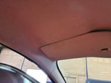 the interior of a car with the sunroof down and the sunroof down