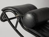black leather chaise lounger with black leather seat and foot rest