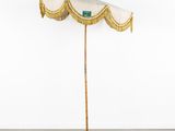 an umbrella that is sitting on top of a wooden pole