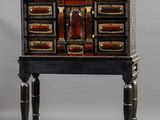 an image of a black and gold chest of drawers