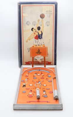 an orange pinball machine with a basketball game in it