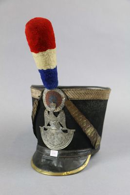 a small cup with a red, white, and blue stick sticking out of it