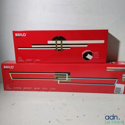 two boxes of nintendo wii controllers sitting on top of each other