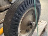 a wheel that is sitting on a pallet in a warehouse