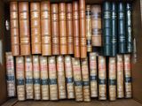 a box full of old books sitting on top of a table