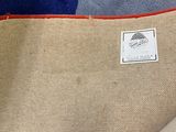 a bag with a label on it sitting on the floor