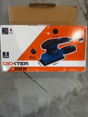an orange box with a blue and black sander in it