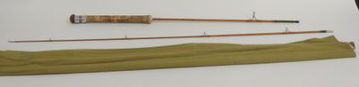 two fishing rods and a fishing rod on a table