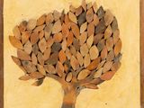an image of a picture of a tree made out of leaves