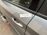 a sticker on the door of a car that says vauto