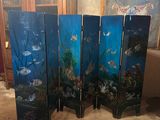 four panel room divider with a fish scene painted on it