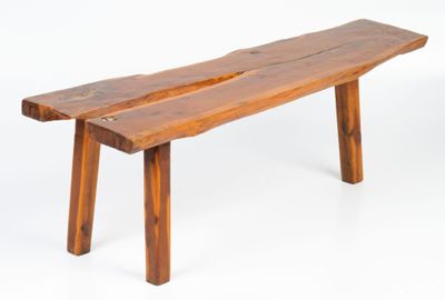 a wooden bench that is sitting on a white surface
