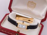 an image of a watch in a red box with a gold clasp