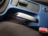 a close up of a car door handle with a remote control