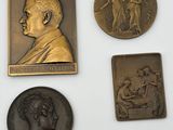 some of the medals are on display on a white surface