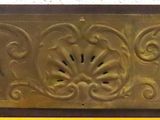 a picture of a gold plaque on a white wall