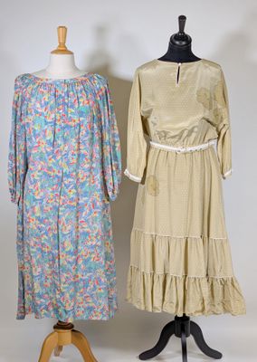 two dresses on a mannequin stand on a white background