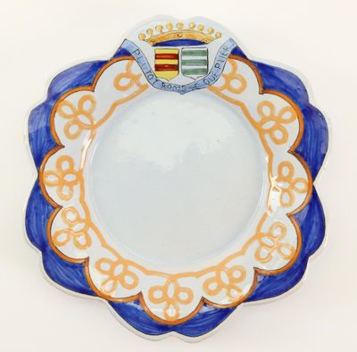 a blue and white plate with a crown on it