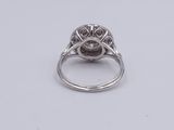 a close up of a silver ring with a stone in the center