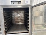 an image of a commercial oven with a lot of trays in it