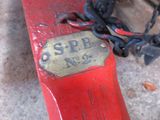 a red fire hydrant with a chain attached to it