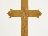 gold plated cross ornament with the names of jesus and the names of his people