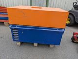 a blue and orange box sitting on a pallet