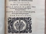 an open book with a picture of a fleur on it