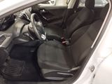 the interior of a white car with black seats and a steering wheel