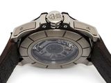 a close up of a watch on a white surface