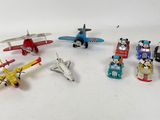 a lot of small toy airplanes on a white surface